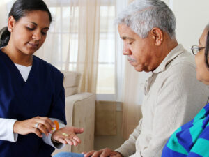 nurse giving medication to patient