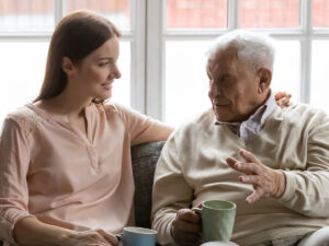 elder and women speaking on the couch
