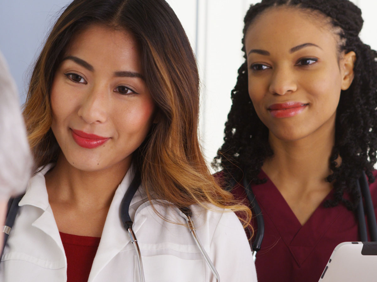 doctor and nurse speaking to patient